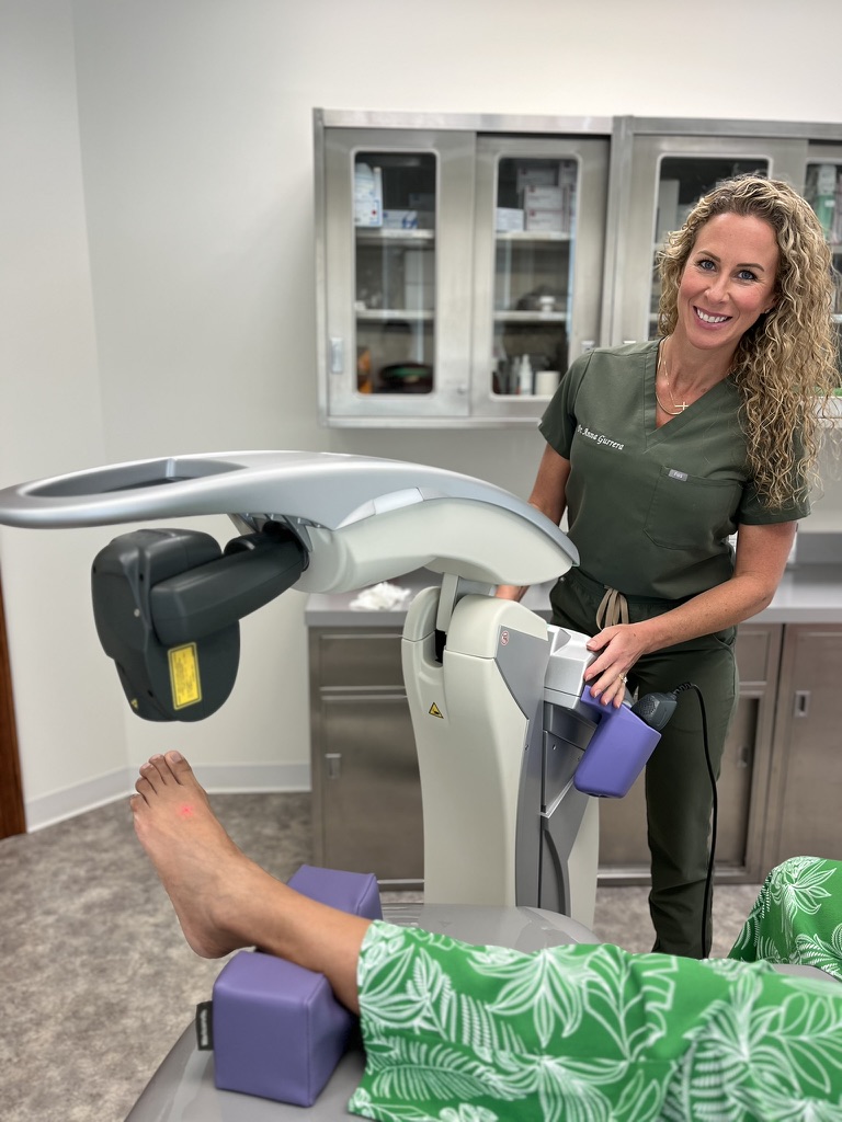 Dr. Anna Gurrera providing shockwave therapy treatment for heel pain at Alpine Foot Specialists in Lake Zurich Illinois